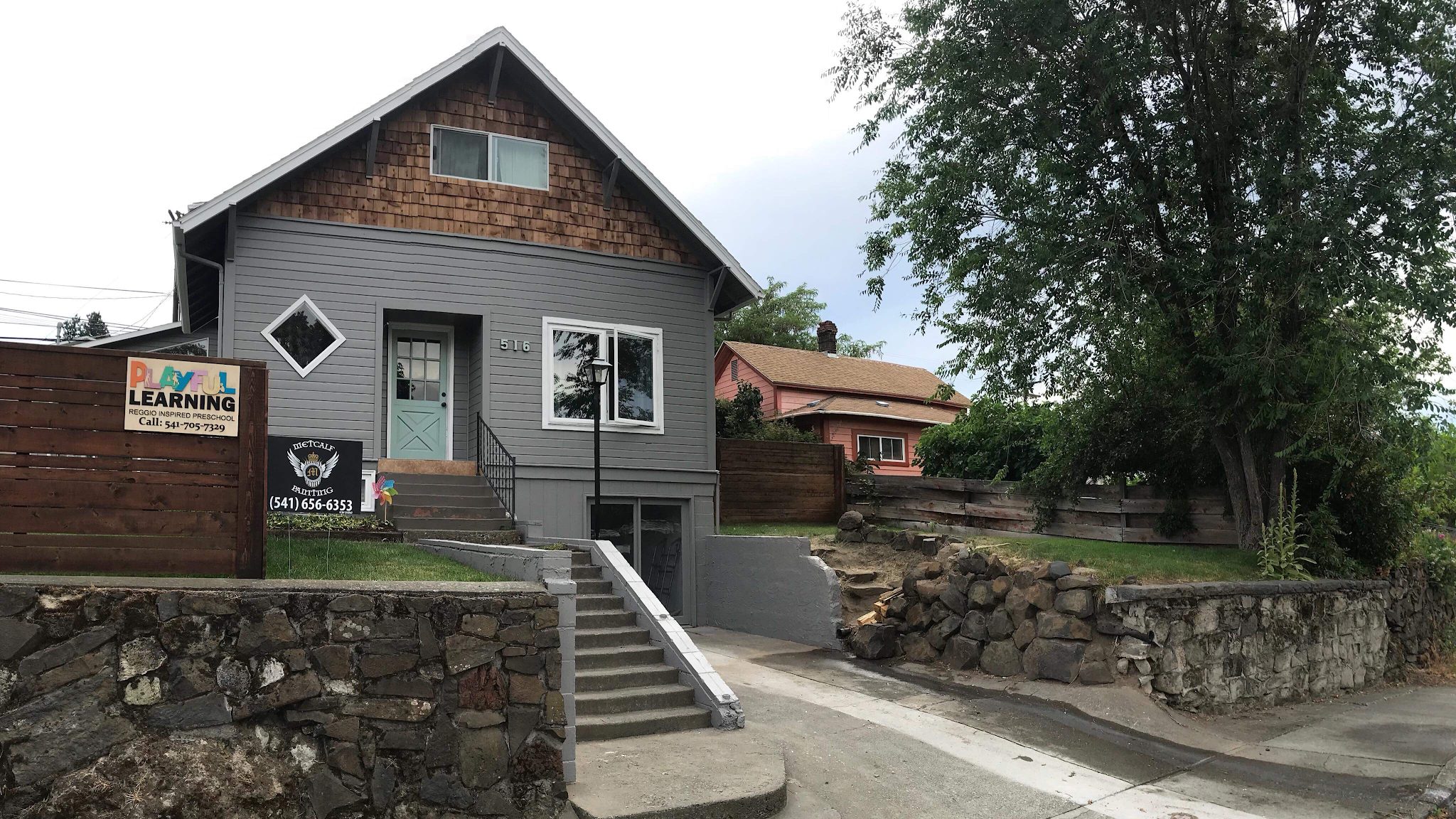 Grey craftsman house in Pendleton finished by Metcalf Painting, with cedar shingles and white trim